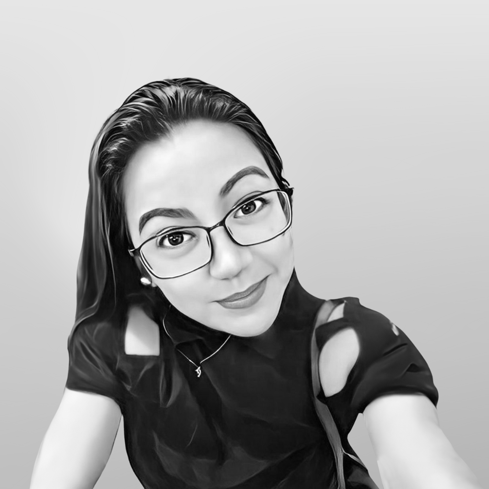 Portrait of a woman with glasses and a black top, smiling and engaging with the camera, representing the Tech Marketing Team's personal touch in digital marketing services.