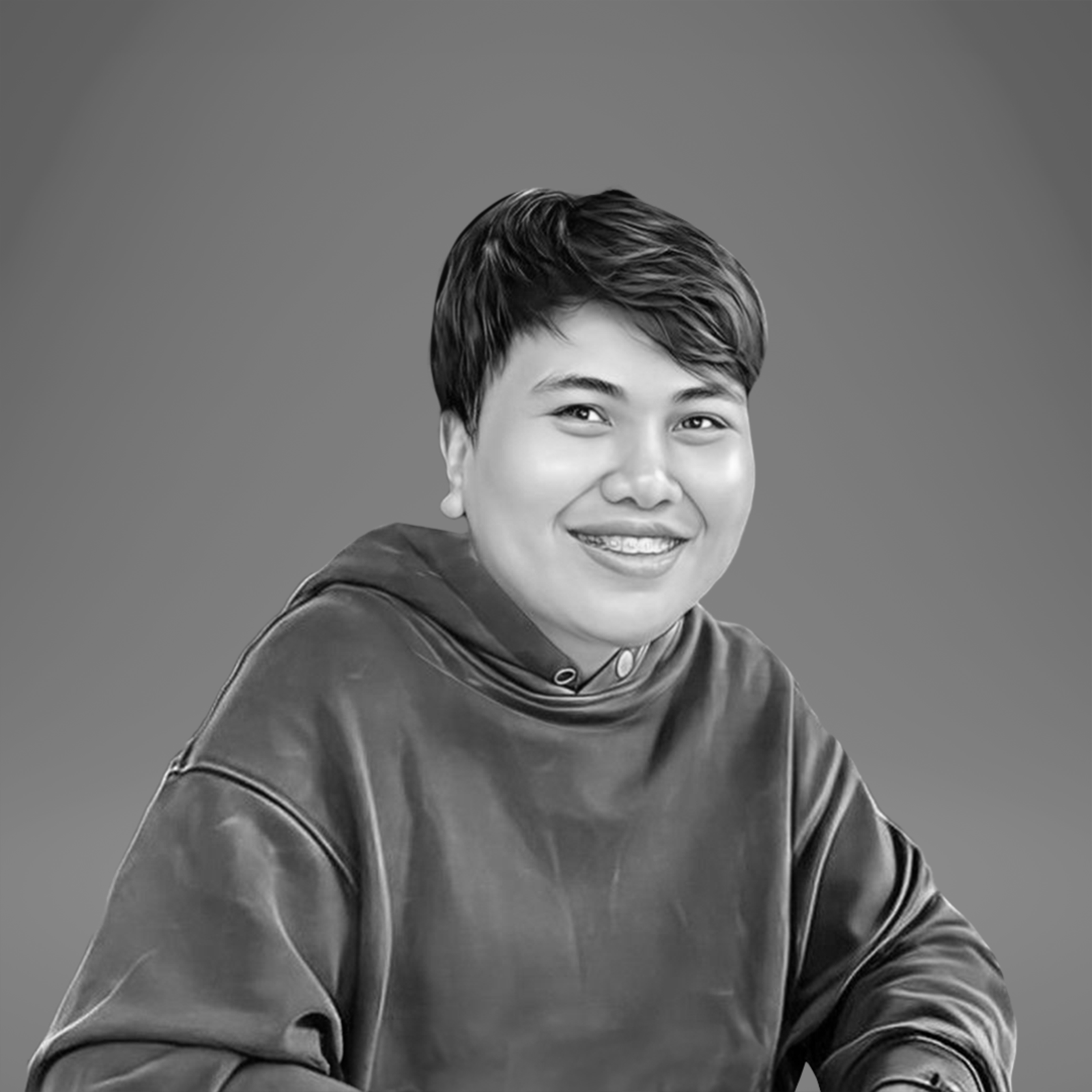 Smiling young individual in a hoodie, representing the multimedia design team at Tech Marketing Team, emphasizing creative collaboration and digital marketing expertise.